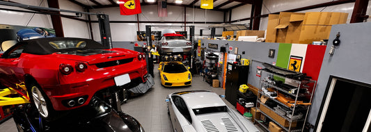 Ferrari, Lamborghini and Maserati vehicles in the GTE Engineering workshop