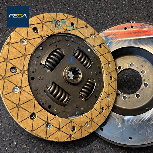 002132598 Lamborghini Diablo clutch disc beside pressure plate and flywheel, PEGA Clutch service example