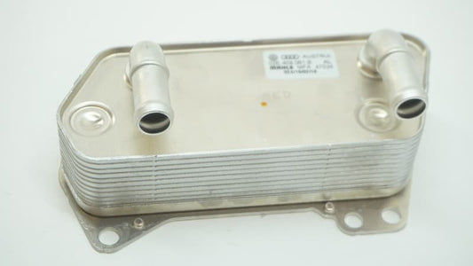 02E409061B oil cooler for applicable Aventador systems, showing two pipe connections, mounting flange and original Volkswagen Audi label