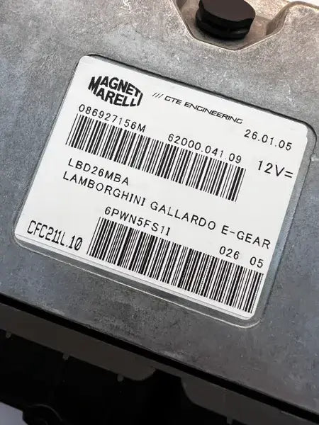 Original Magneti Marelli Gallardo E-Gear controller label showing hardware 086927156M and software LBD26MBA.
