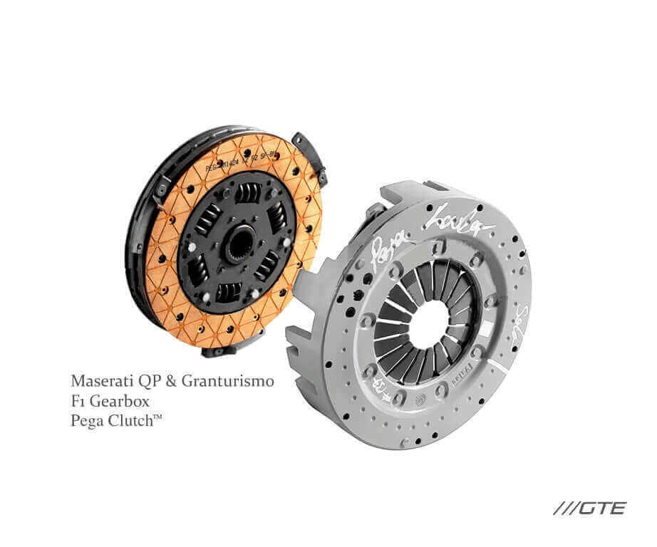 Original Maserati Quattroporte and GranTurismo clutch service photograph showing orange friction lining and handwritten pressure-plate inspection marks