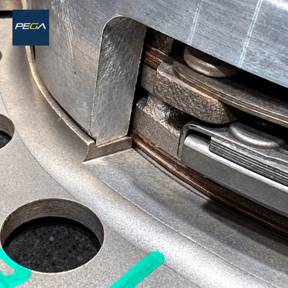Aston Martin clutch service example showing plate clearance, friction layers and green witness marks in close-up
