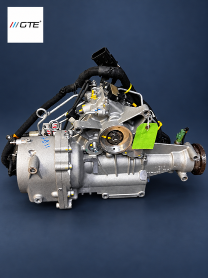 Engine-facing side of a Ferrari FF and GTC4Lusso 4RM PTU showing the central input coupling and engine mounting face.