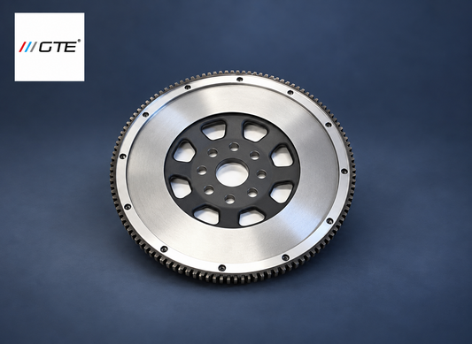 GTE flywheel service example showing the machined friction face, black center and ring gear; exact application varies.