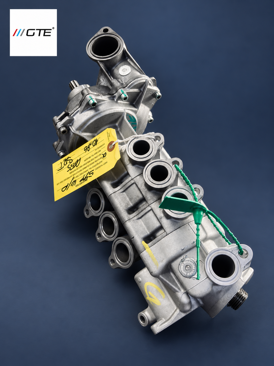 GTE Engineering water-pump rebuild service example for Ferrari and Maserati listings, with green security seals and inspection tag; housing varies by application