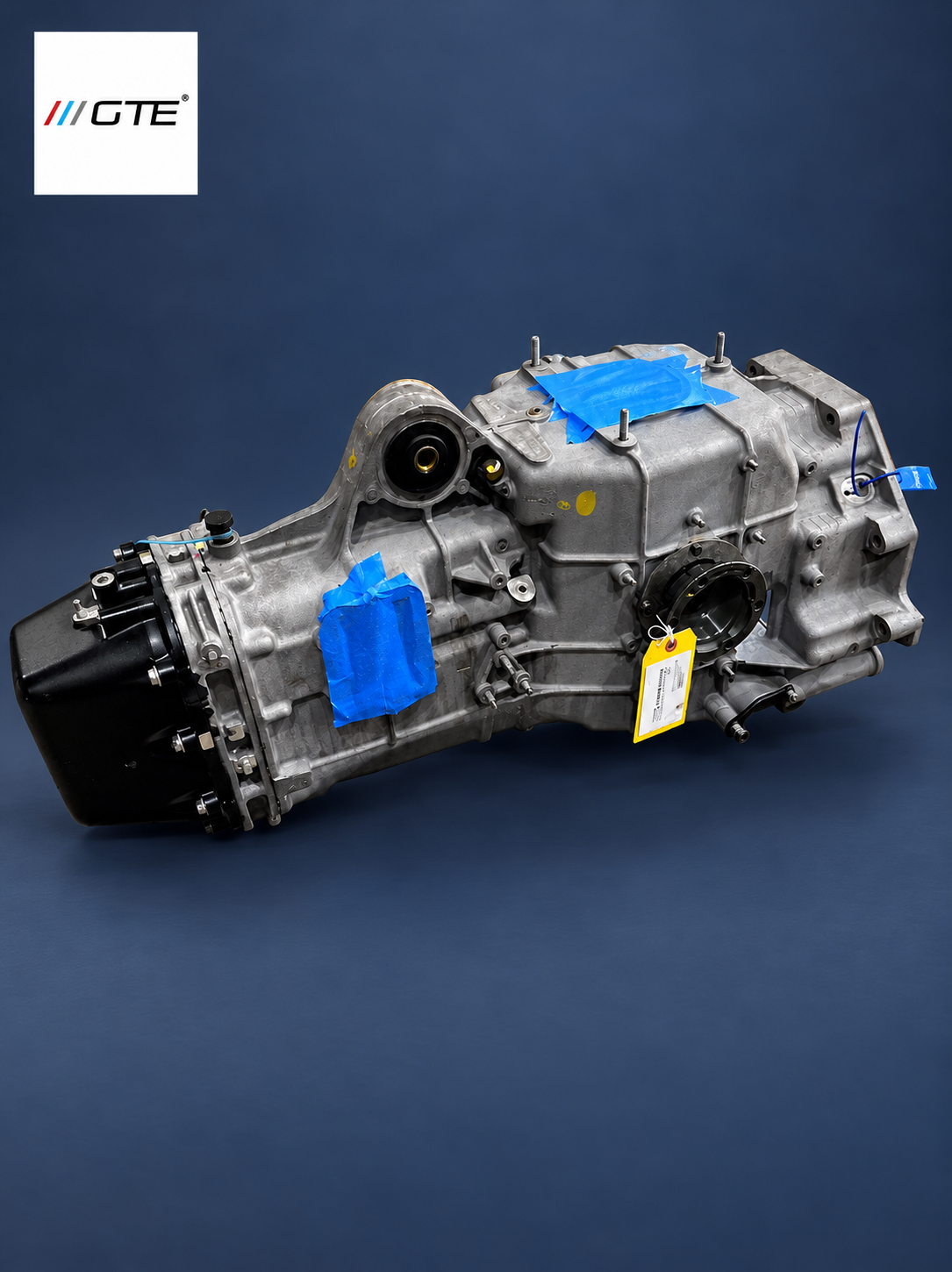 Ferrari 360 Modena transmission rebuild, side view with output flange and inspection tag.