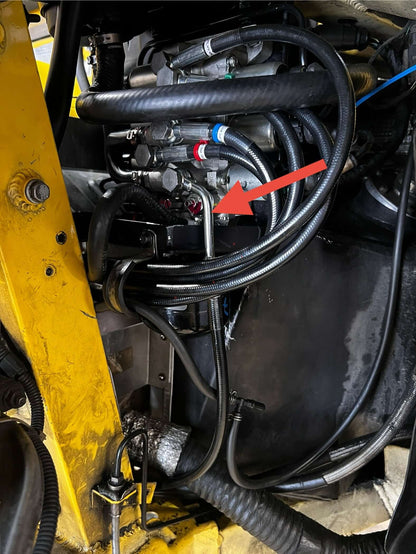Lamborghini Gallardo clutch hose routing with fitting indicated by red arrow
