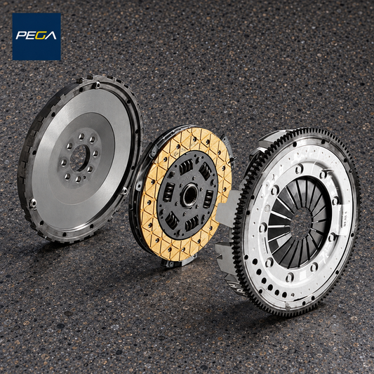 Lamborghini Gallardo E-Gear service example showing a flywheel, yellow-lined sprung clutch disc and pressure plate; exact assembly version is not identified by this photo