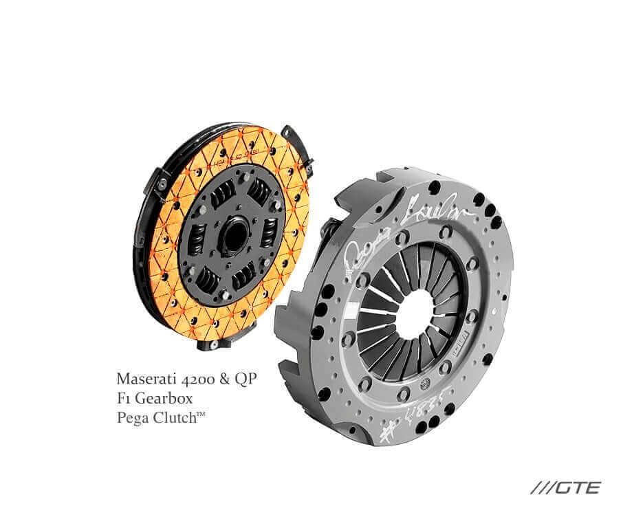 Original Maserati 4200 clutch service-example photograph showing an orange-lined disc and pressure plate with handwritten PEGA Kevlar inspection marks