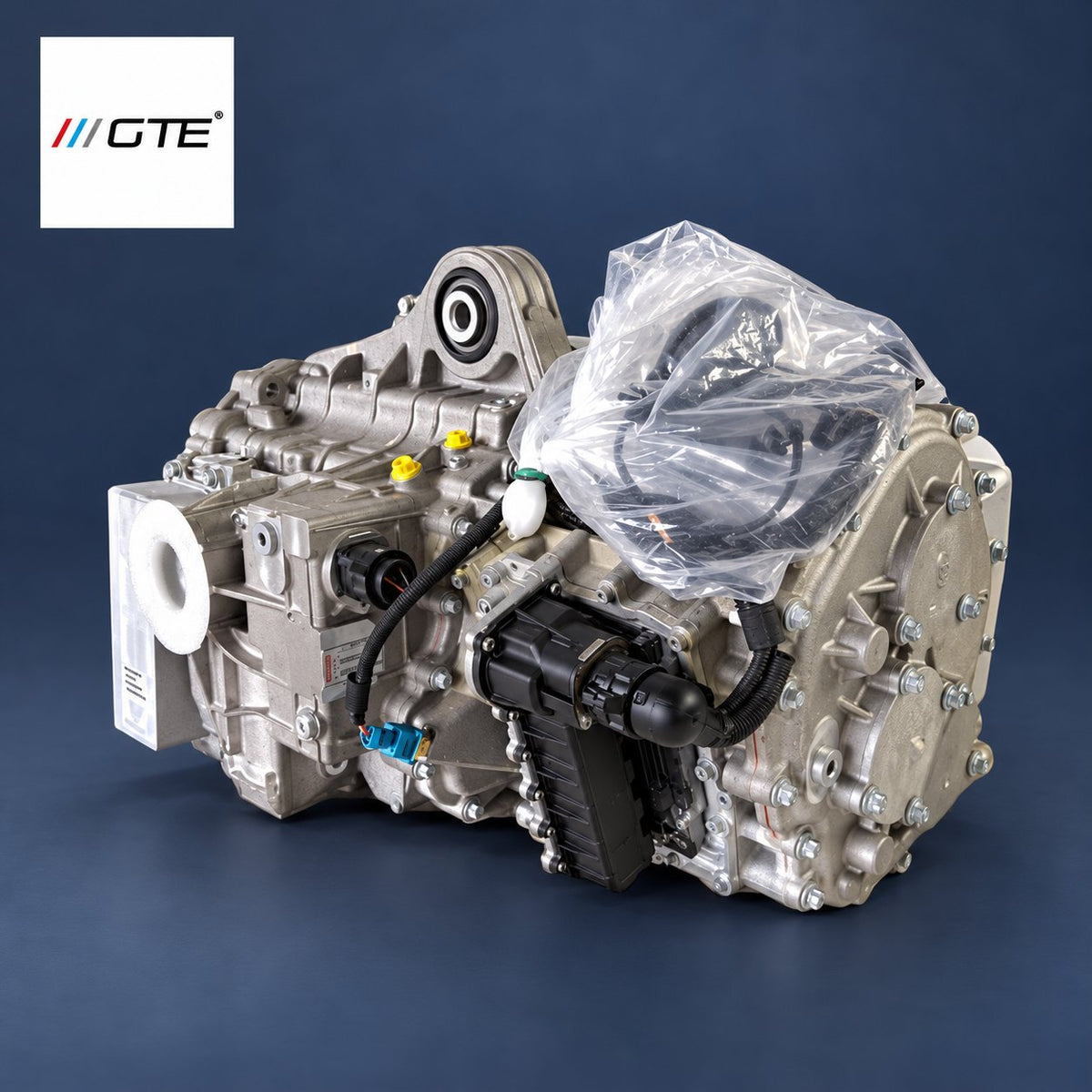 McLaren Graziano DCT transmission service example in GTE studio presentation, with protective packaging, wiring and capped ports.