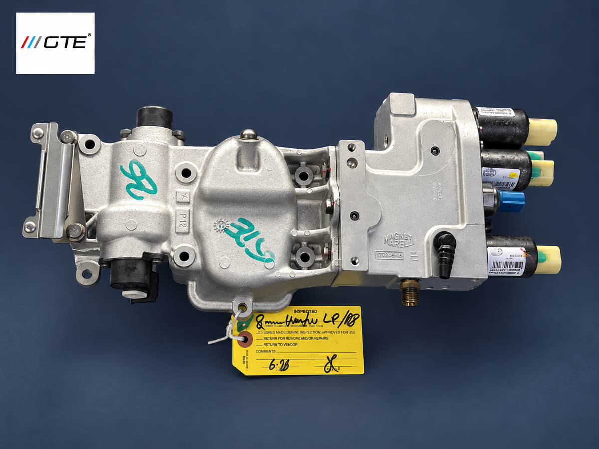 Rebuilt hydraulic transmission shift actuator showing valve body and capped hydraulic connections